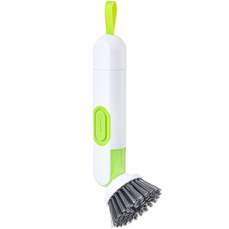 Cleaning brush with white handle and green accents on a white background