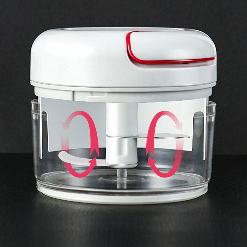 White and red kitchen tool with clear container on a black background