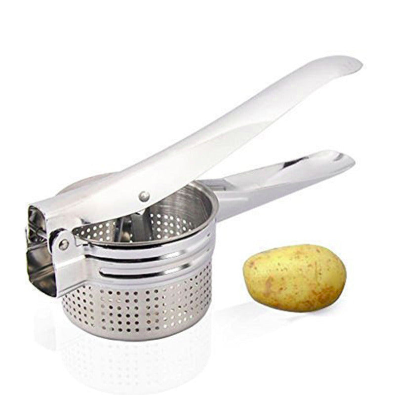 Metal potato ricer with a white handle next to a potato on a white background
