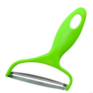 A bright lime green vegetable peeler with a stainless steel blade, shown on a plain white background.