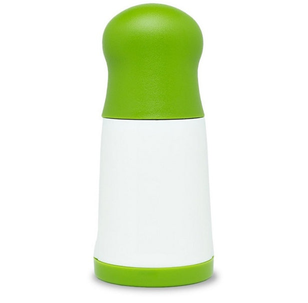 Green and white pepper grinder on a white background