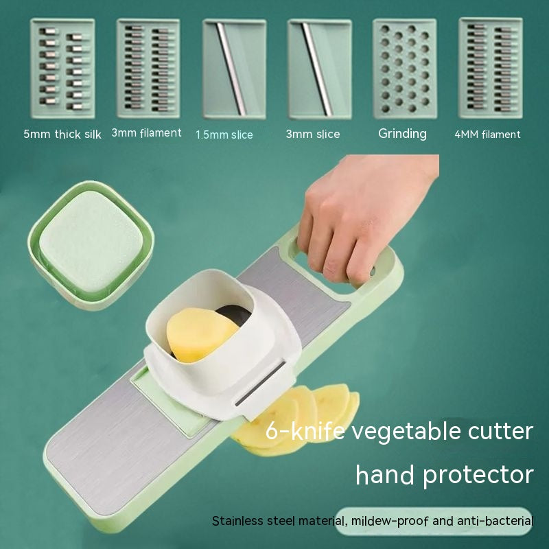 6-knife vegetable cutter with hand protector on a green background