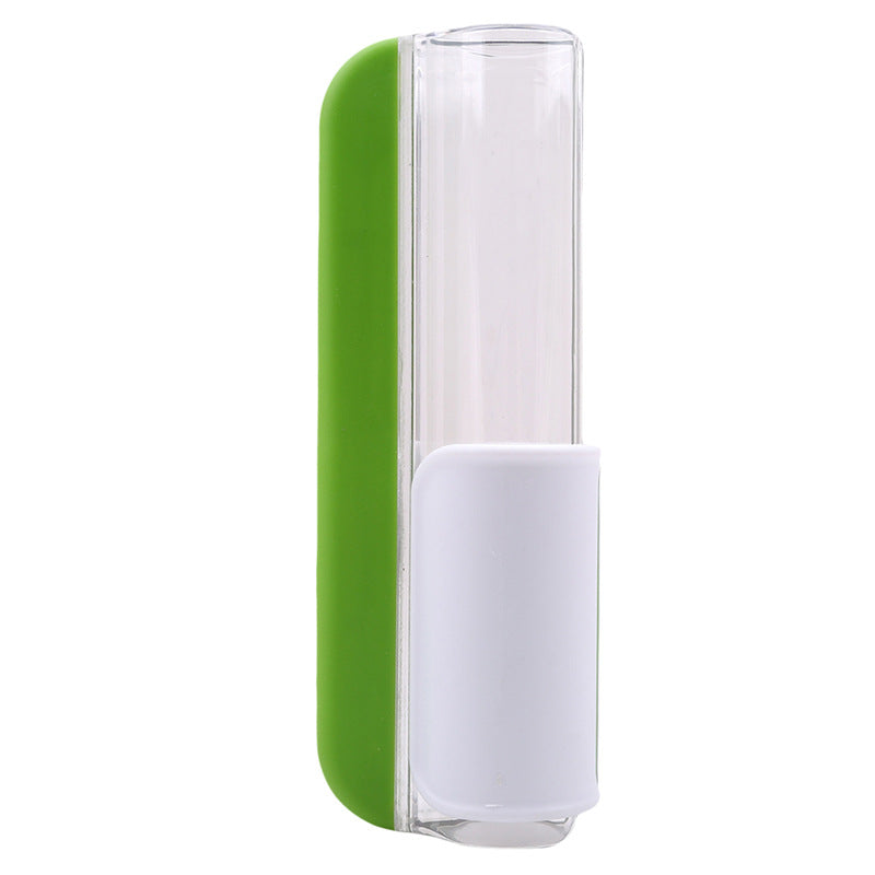 Clear glass with green and white base on a white background