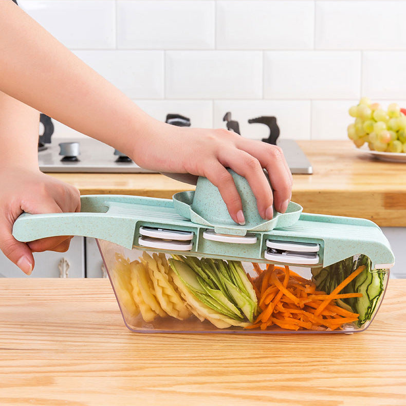 Vegetable chopper with sliced vegetables on a kitchen counter