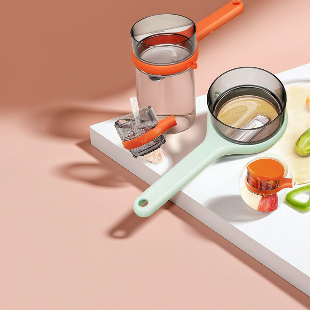 A set of modern kitchen strainers and cups with translucent gray bodies and bright orange accents, arranged on a white tray against a soft peach-pink background.