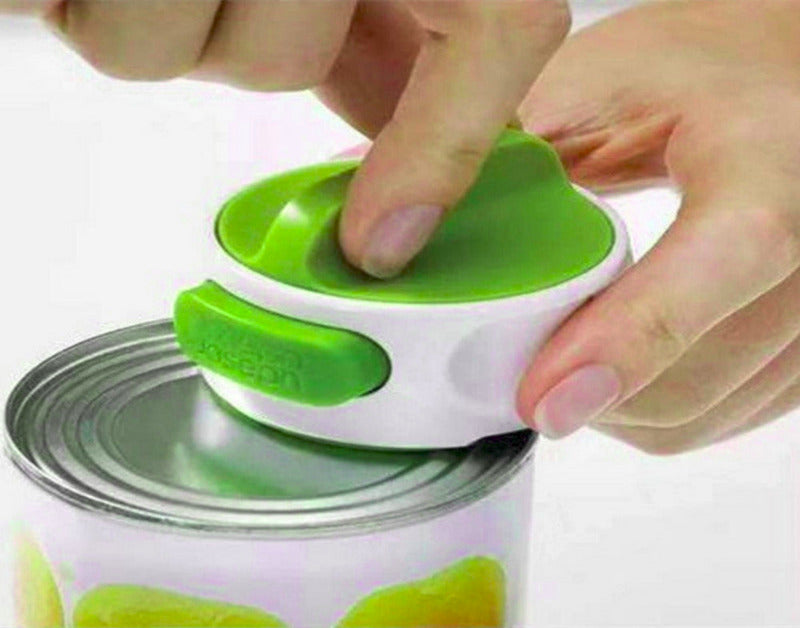 Hand using a can opener with a green handle on a white background