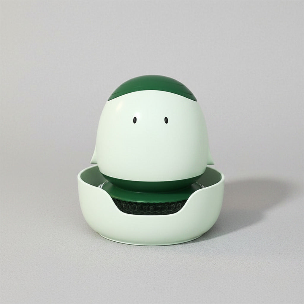 Green and white robot-like device on a wooden surface
