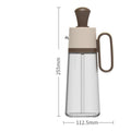 Clear glass bottle with brown cap and handle, dimensions indicated on a white background