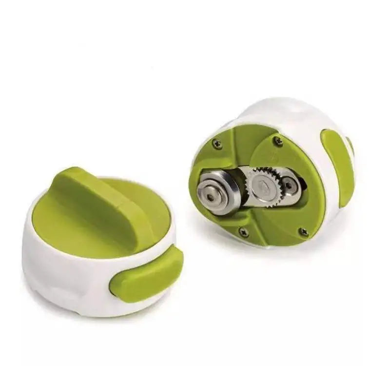 Green and white kitchen tool with gear mechanism on a white background