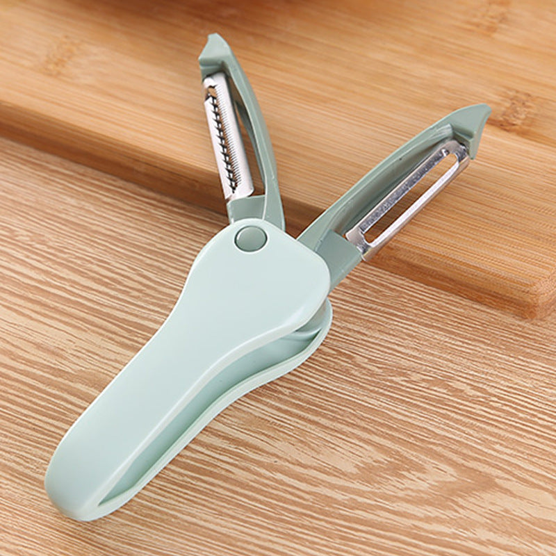 Double-sided vegetable peeler on a wooden surface