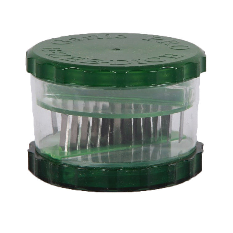 Green and clear container with pins inside on a white background