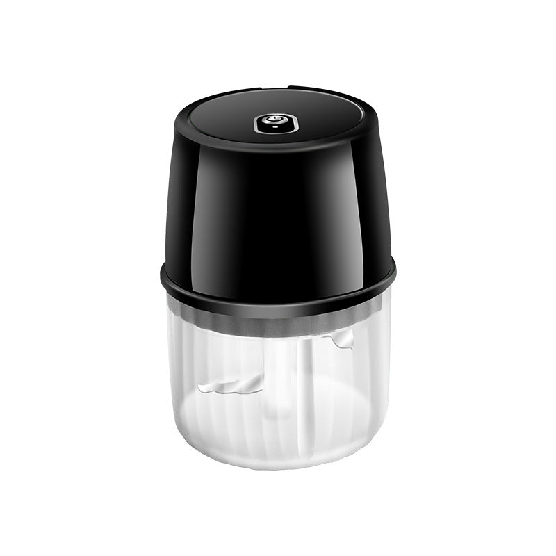 Black and clear handheld blender on a white background